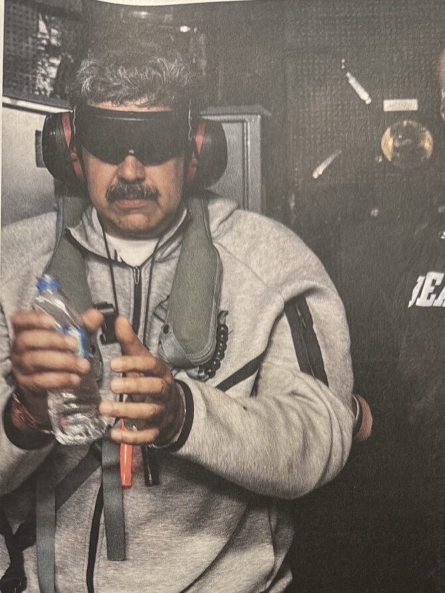 Photo of Venezuelan president Nicolás Maduro captured aboard USS Iwo Jima, blindfolded and wearing earmuffs.